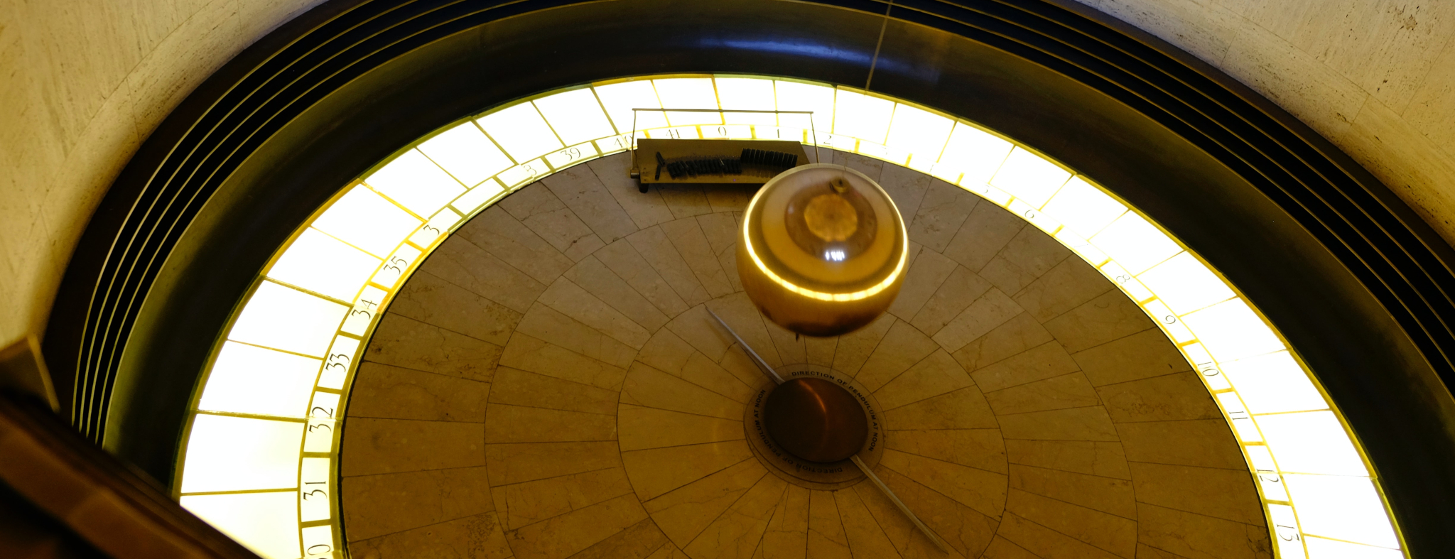 Picture of a pendulum in a circular pit, by Mike Von